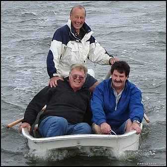 081116_LaurieDougCyrill_inDinghy_closer_800x800_opt8copyADV.jpg