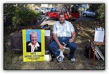 05_080913_RodneyPenny_sittingbesideposter_900x500_opt8ADV.jpg
